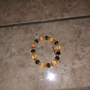 Elegant Orange and Gold Beaded Bracelet with Cross